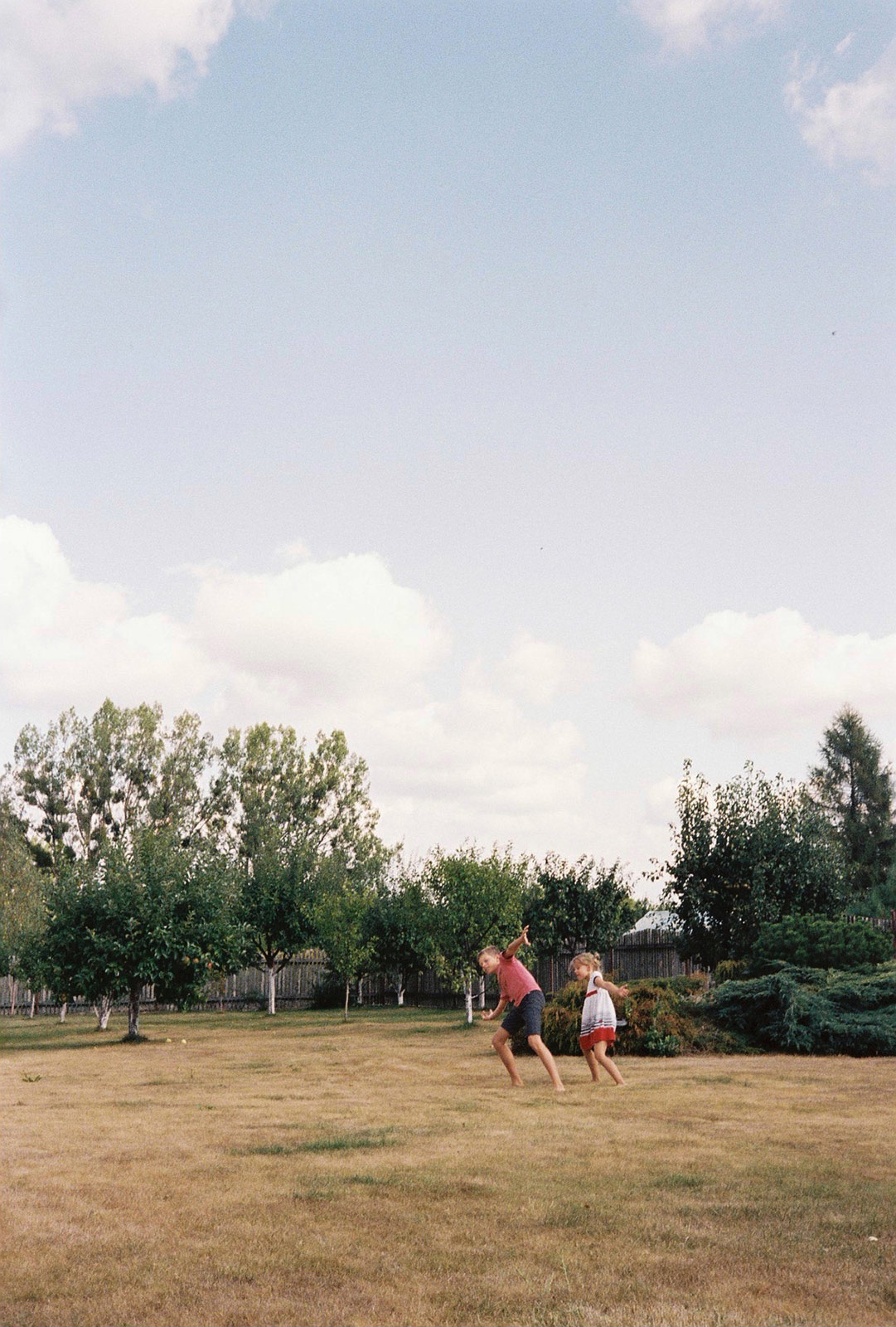 Jerzyk teaches Lucja how to throw a ball.