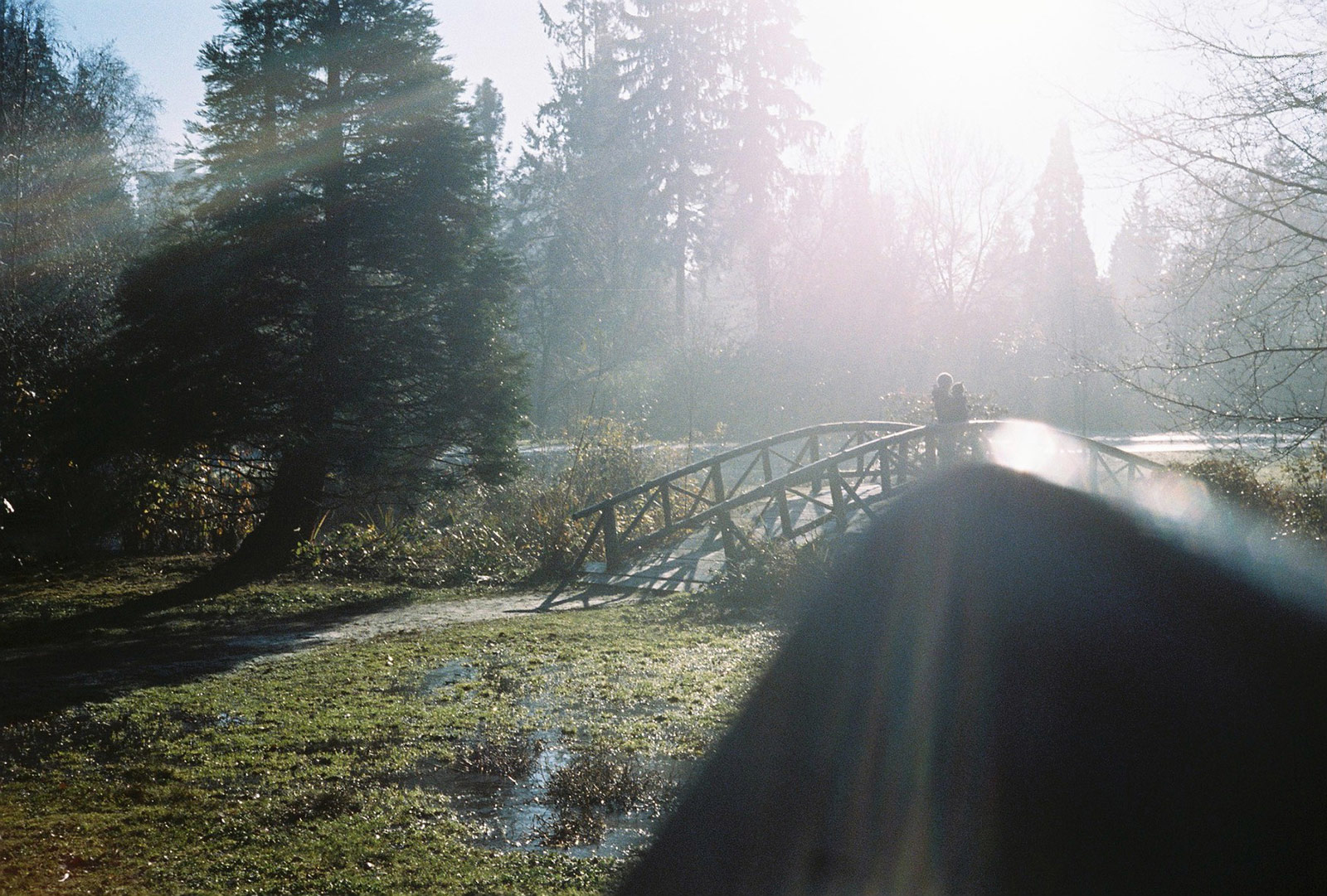Hobbits on a bridge... with a camera bag.